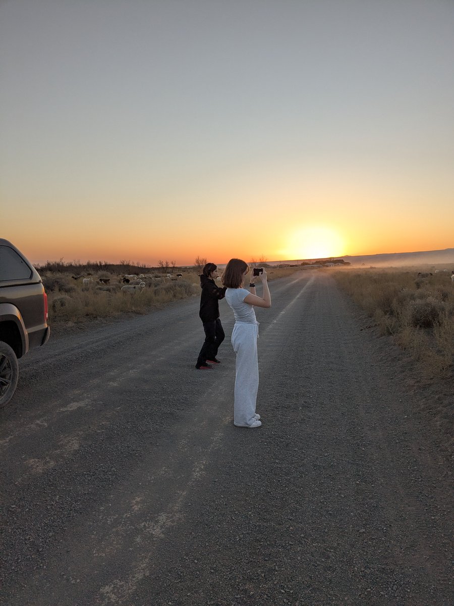 Guests photographing golden sunset on the steppe road — Altyn-Emel National Park drive