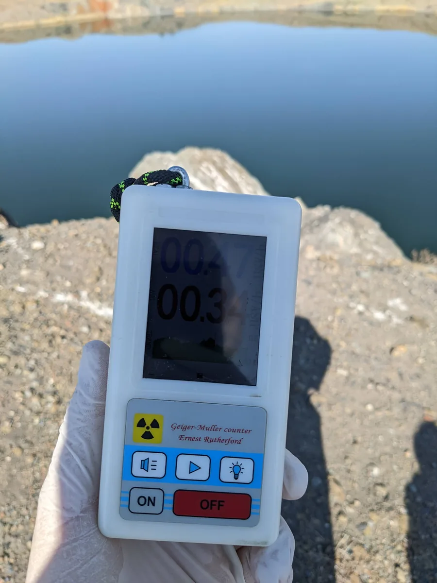 Geiger-Muller counter reading held in gloved hand at the Semipalatinsk nuclear test site