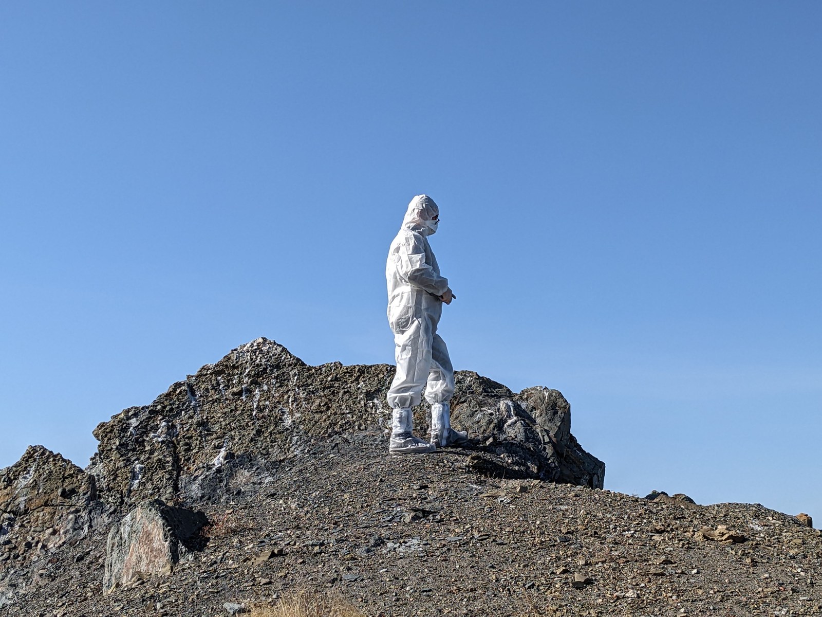 Visitor in full protective gear at the Semipalatinsk nuclear test site, Kazakhstan — private guided expedition