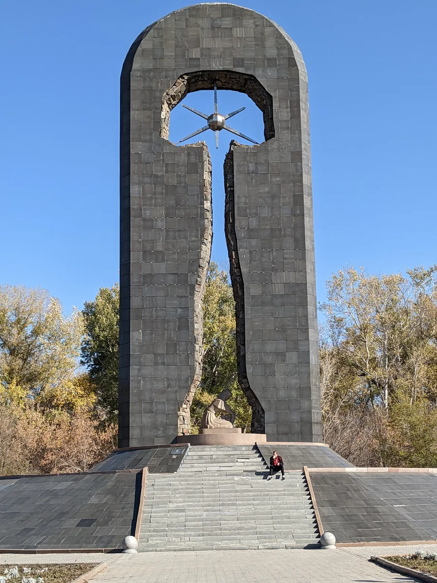 Semipalatinsk nuclear test site memorial monument with split arch and atomic symbol, Semey Kazakhstan