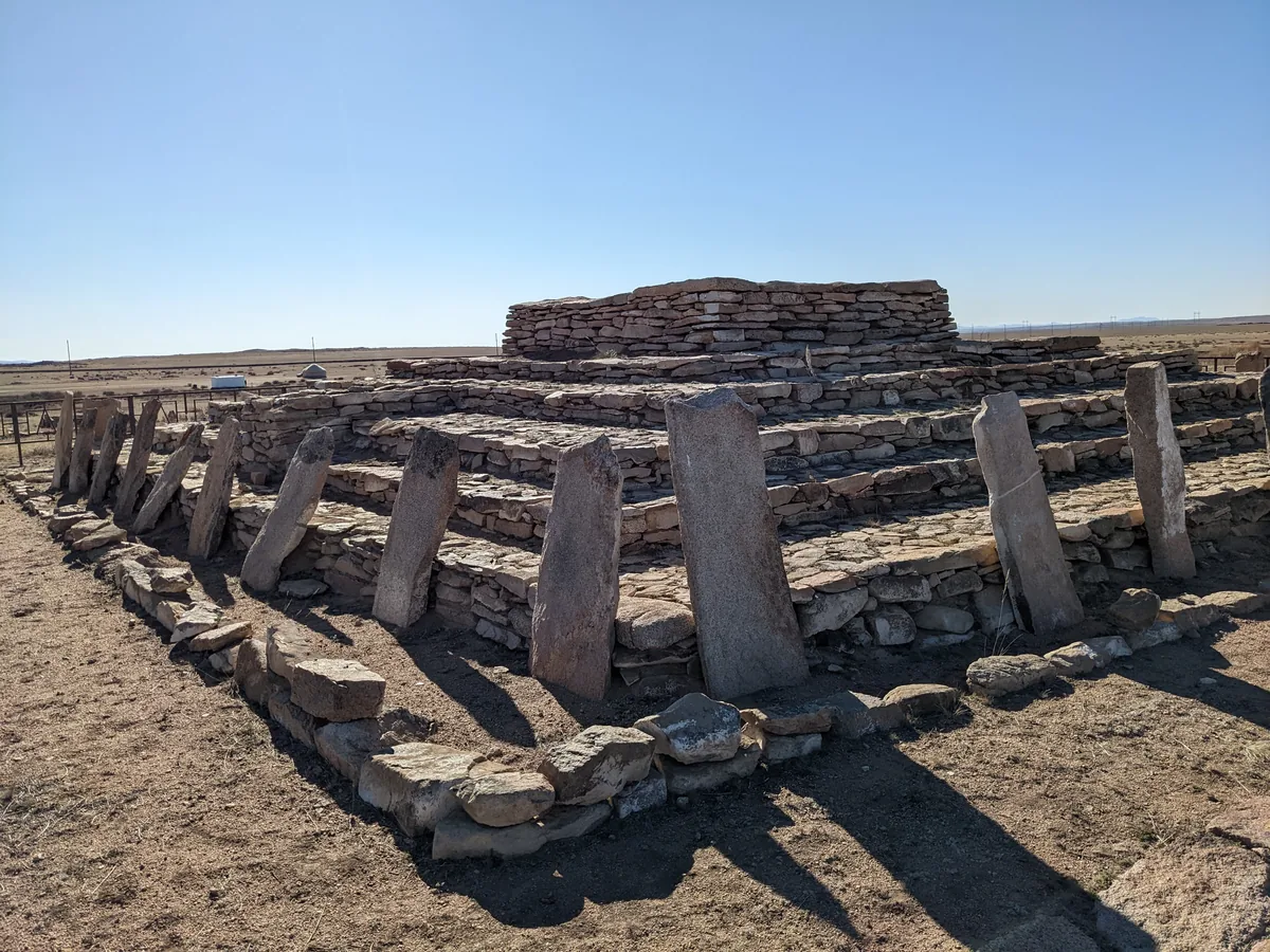 Ancient stone burial mound with standing slabs on the Kazakhstan steppe