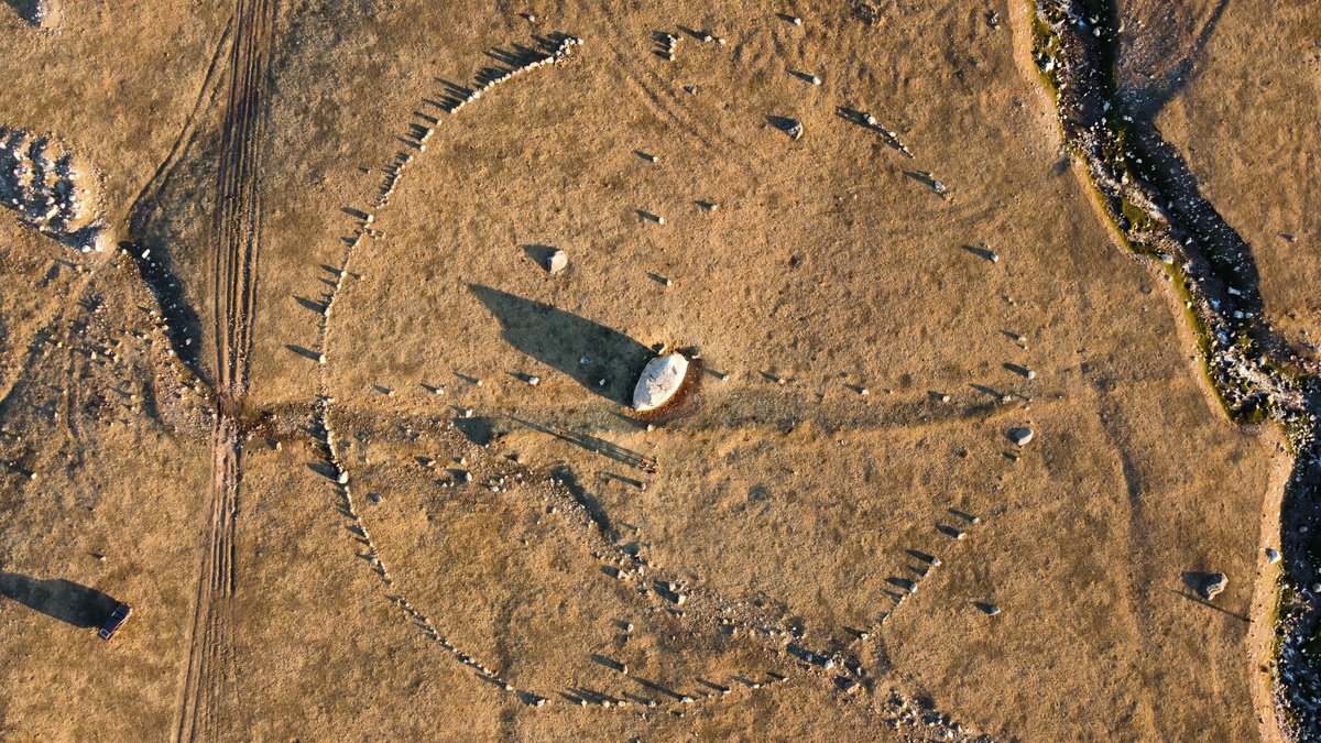 Aerial drone view of Bayan-Zhurek stone observatory with river
