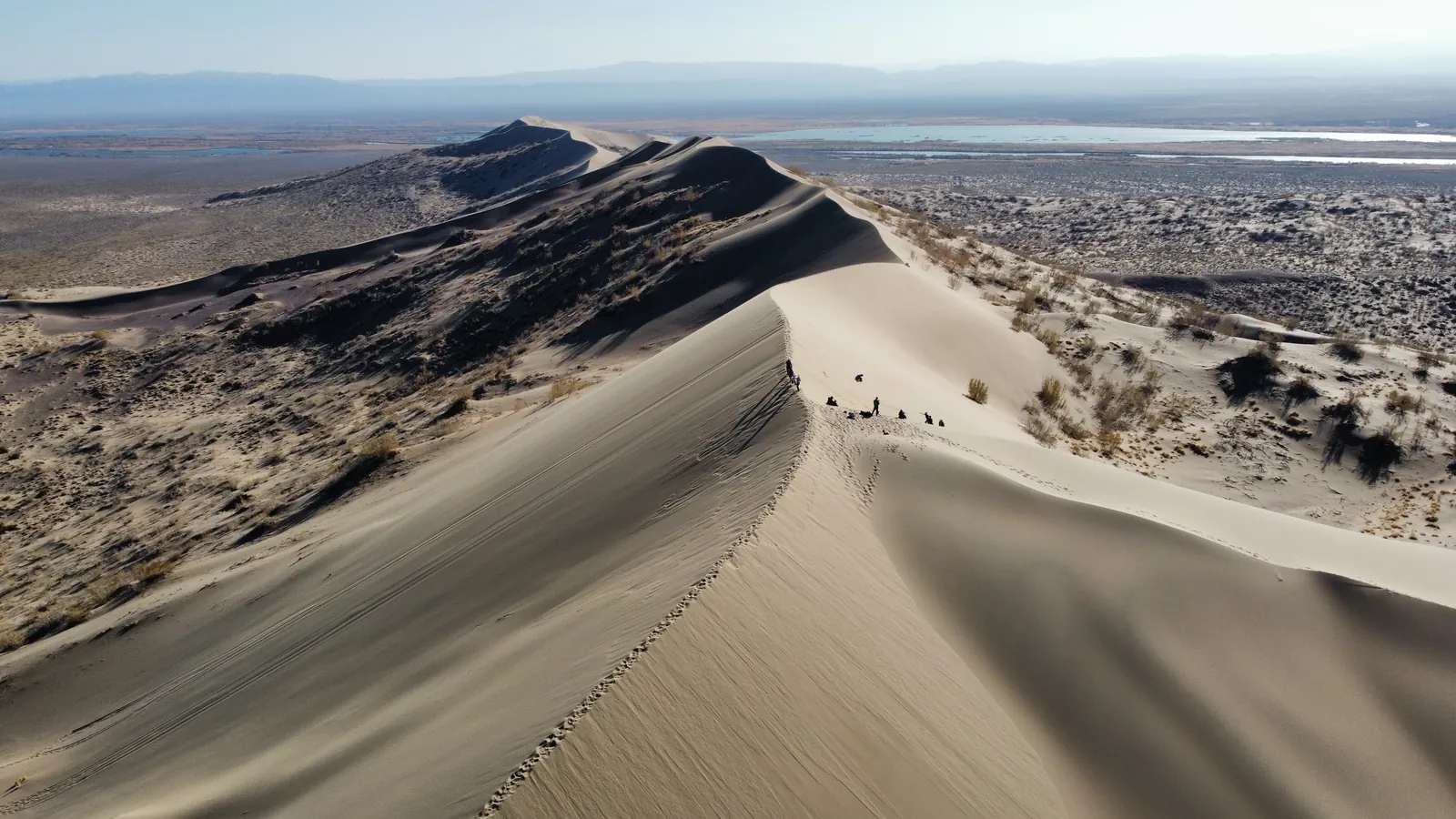 The view from the summit of the Singing Dune across the Ili River valley toward the Tien Shan