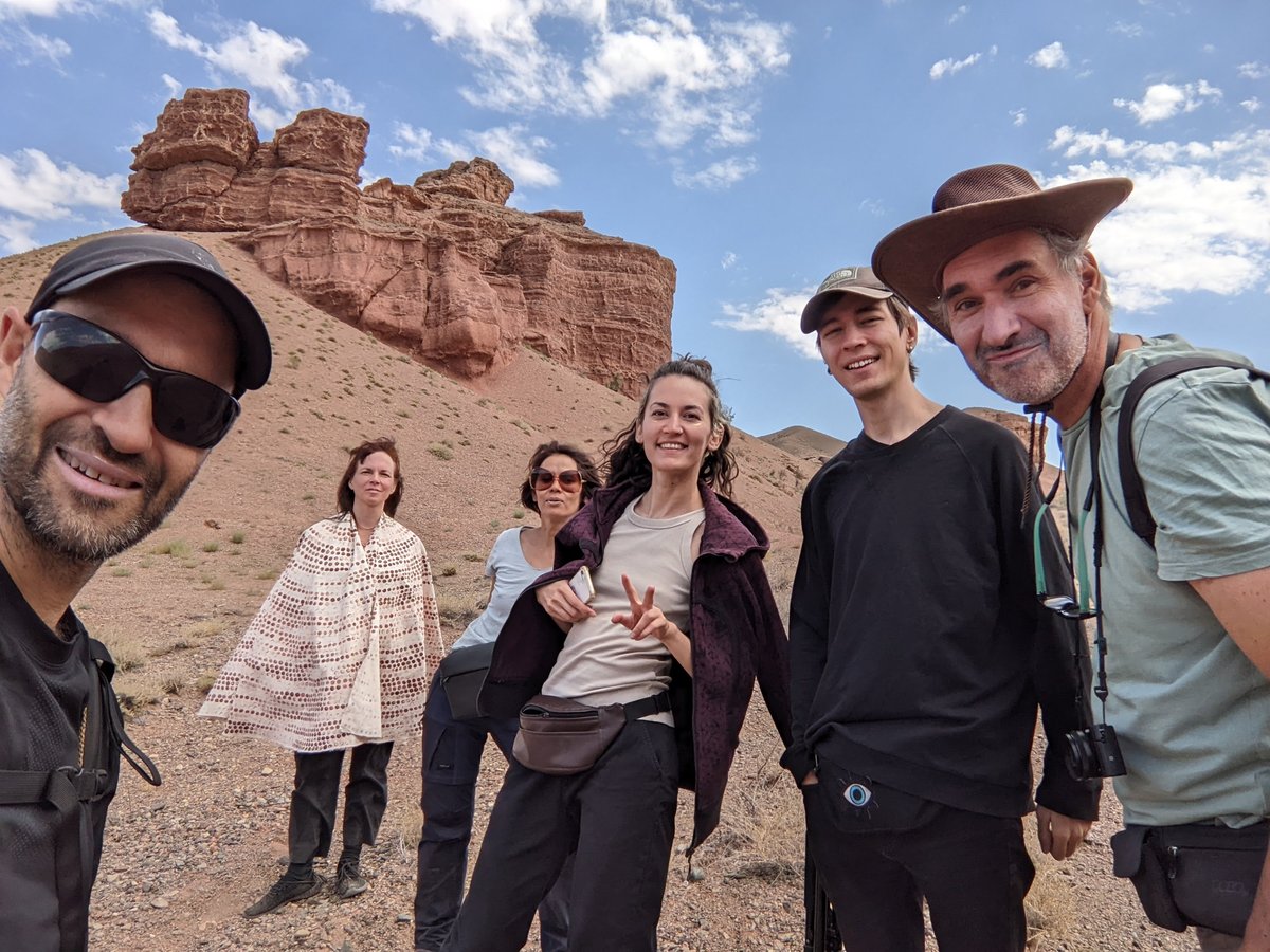 Guests on Arna Jol Temirlik Canyon overnight expedition with canyon spire backdrop