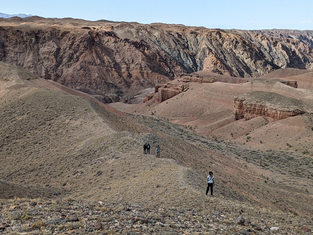 Temirlik Canyon wide panorama with dramatic clouds — private overnight expedition from Almaty